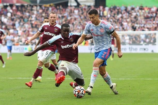 Kurt Zouma of West Ham tackles Cristiano Ronaldo of Man Utd in the box during the Premier League match between West Ham United and Manchester United...