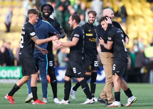 Livingston manager David Martindale celebrates with his players at full time during a cinch Premiership match between Livingston and Celtic at the...