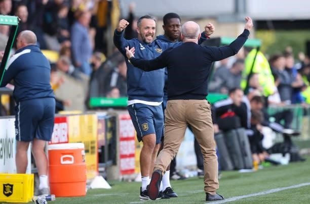 The Livingston coaching staff celebrate during a cinch Premiership match between Livingston and Celtic at the Tony Macaroni Arena on September 19 in...