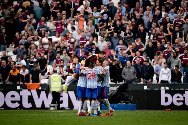 Diogo Dalot of Manchester United celebrates with his team-mates at the end of the Premier League match between West Ham United and Manchester United...
