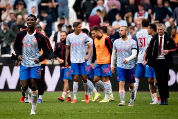 Paul Pogba of Manchester United reacts with his team-mates at the end of the Premier League match between West Ham United and Manchester United at...