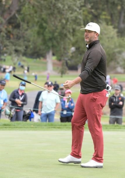 Scott Piercy tosses his club after missing a birdie putt on the third hole during the third round of the Fortinet Championship at Silverado Resort...