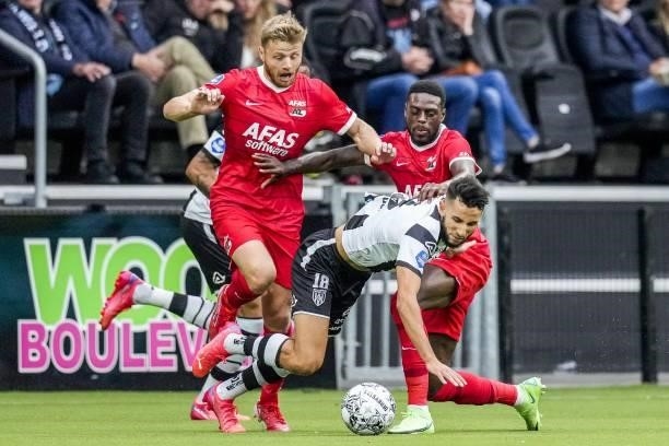 Fredrik Midtsjo of AZ, Ismail Azzaoui of Heracles Almelo, Bruno Martins Indi of AZ during the Dutch Eredivisie match between Heracles Almelo and PSV...