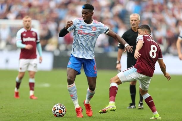 Paul Pogba of Man Utd and Pablo Fornals of West Ham during the Premier League match between West Ham United and Manchester United at London Stadium...