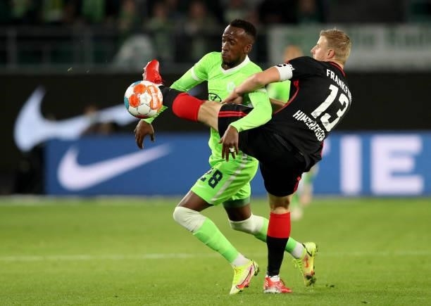 Wolfsburg's Belgian forward Dodi Lukebakio and Frankfurt's German defender Martin Hinteregger vie for the ball during the German first division...