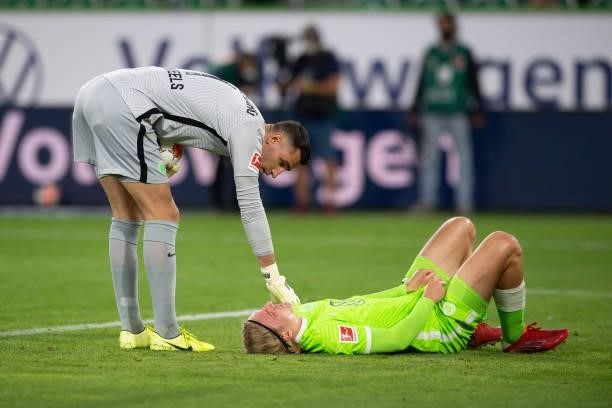Goalkeeper Koen Casteels of VfL Wolfsburg and Sebastiaan Bornauw of VfL Wolfsburg injured during the Bundesliga match between VfL Wolfsburg and...