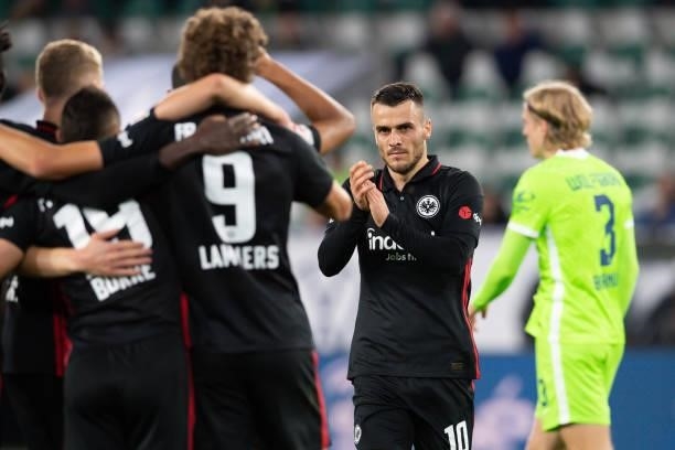 Filip Kostic of Eintracht Frankfurt celebrates after scoring his team's first goal with teammates during the Bundesliga match between VfL Wolfsburg...