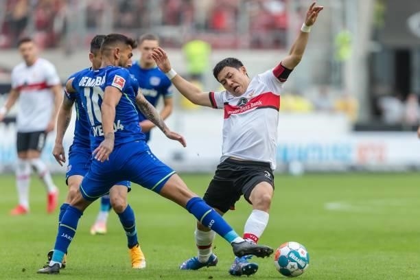 Kerem Demirbay of Bayer 04 Leverkusen and Wataru Endo of VfB Stuttgart battle for the ball during the Bundesliga match between VfB Stuttgart and...