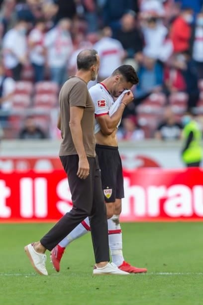 Head coach Pellegrino Matarazzo of VfB Stuttgart and Konstantinos Mavropanos of VfB Stuttgart look dejected after the Bundesliga match between VfB...