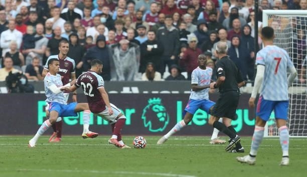 West Ham United's Said Benrahma scores his side's first goal during the Premier League match between West Ham United and Manchester United at London...