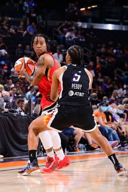Riquna Williams of the Las Vegas Aces handles the ball during the game against the Phoenix Mercury on September 19, 2021 at Footprint Center in...