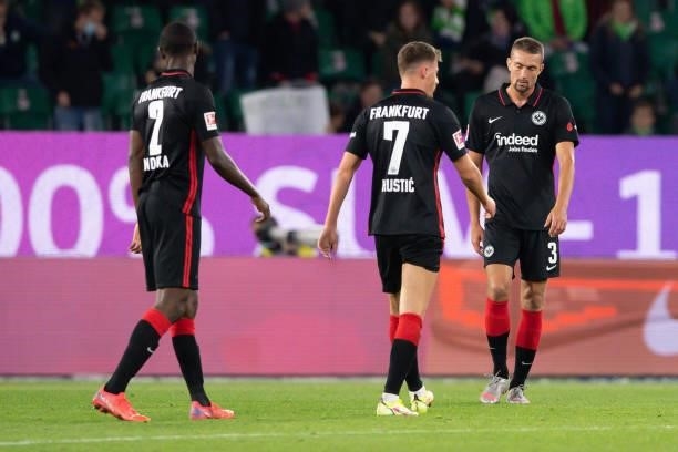 Evan N'Dicka of Eintracht Frankfurt, Ajdin Hrustic of Eintracht Frankfurt and Stefan Ilsanker of Eintracht Frankfurt looks dejected during the...