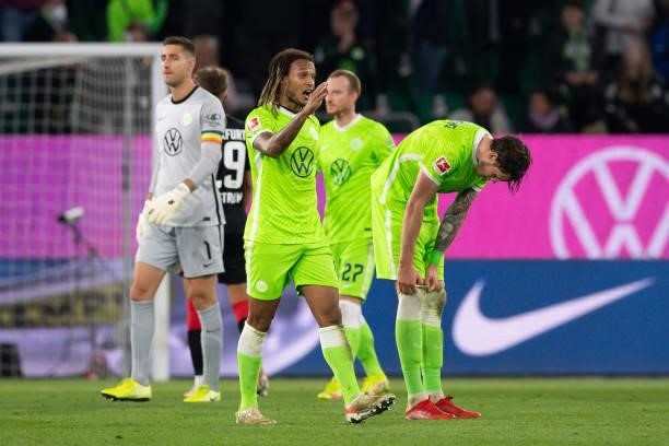 Kevin Mbabu of VfL Wolfsburg and Wout Weghorst of VfL Wolfsburg looks dejected during the Bundesliga match between VfL Wolfsburg and Eintracht...