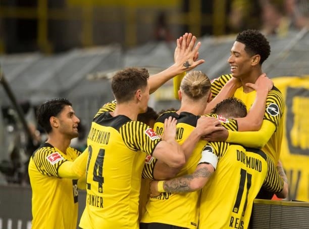 Raphael Guerreiro, Jude Bellingham, Erling Haaland and Marco Reus celebrate the own goal to the 3:0 during the Bundesliga match between Borussia...