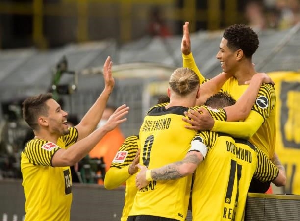 Raphael Guerreiro, Jude Bellingham, Erling Haaland and Marco Reus celebrate the own goal to the 3:0 during the Bundesliga match between Borussia...