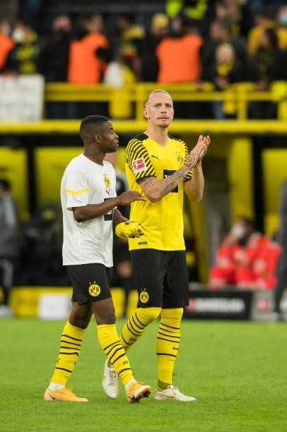 Youssoufa Moukoko and Marius Wolf after the Bundesliga match between Borussia Dortmund and 1. FC Union Berlin on September 19, 2021 in Dortmund,...