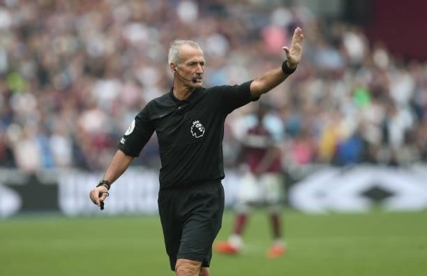 Referee Martin Atkinson during the Premier League match between West Ham United and Manchester United at London Stadium on September 19, 2021 in...
