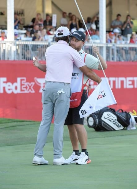 Max Homa celebrates with his caddie on the 18th green after winning the Fortinet Championship at Silverado Resort and Spa North on September 19, 2021...