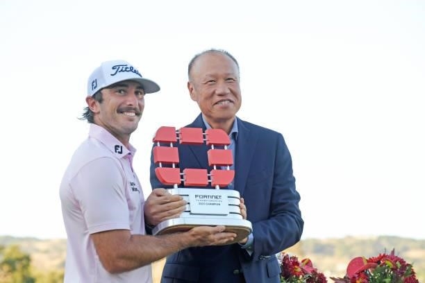 Max Homa poses with Fortinet Founder And CEO Ken Xie following his win of the Fortinet Championship at Silverado Resort and Spa North on September...
