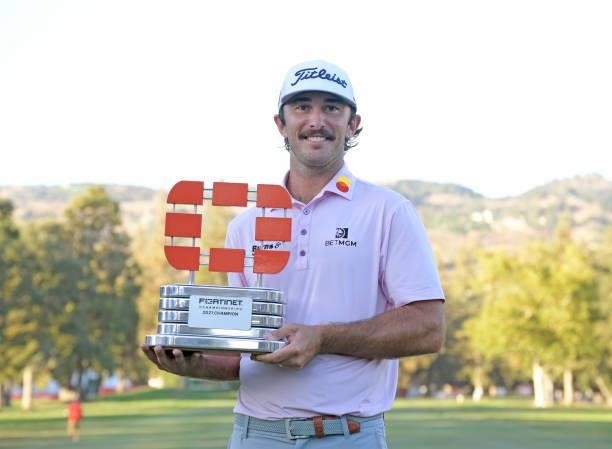 Max Homa celebrates with the champion's trophy after winning Fortinet Championship at Silverado Resort and Spa North on September 19, 2021 in Napa,...