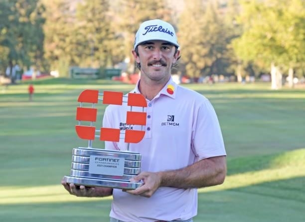 Max Homa celebrates with the champion's trophy after winning Fortinet Championship at Silverado Resort and Spa North on September 19, 2021 in Napa,...