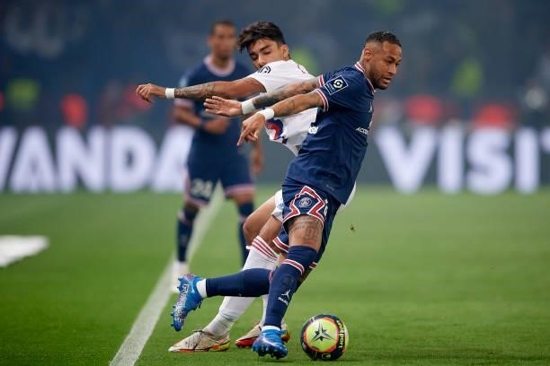Neymar of PSG and Lucas Paqueta of Olympique Lyonnais compete for the ball during the Ligue 1 Uber Eats match between Paris Saint Germain and Lyon at...
