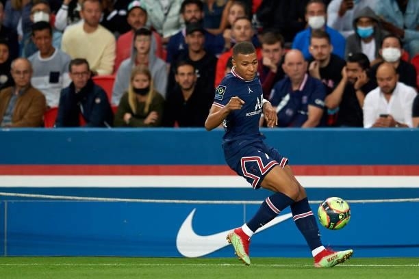 Kylian Mbappe of PSG in action during the Ligue 1 Uber Eats match between Paris Saint Germain and Lyon at Parc des Princes on September 19, 2021 in...