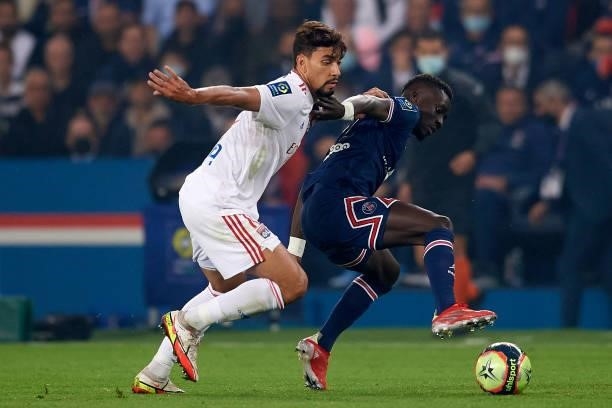 Idrissa Gueye of PSG and Lucas Paqueta of Olympique Lyonnais compete for the ball during the Ligue 1 Uber Eats match between Paris Saint Germain and...