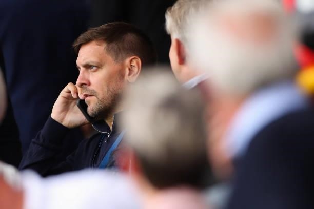 Jonathan Woodgate on his mobile phone during the Premier League match between Burnley and Arsenal at Turf Moor on September 18, 2021 in Burnley,...