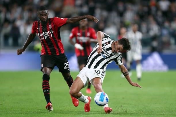Paulo Dybala of Juventus FC and Fikayo Tomori of AC Milan battle for the ball during the Serie A match between Juventus and AC Milan at Allianz...