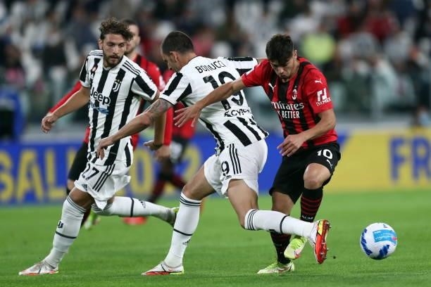 Brahim Diaz of AC Milan and Leonardo Bonucci of Juventus FC battle for the ball during the Serie A match between Juventus and AC Milan at Allianz...