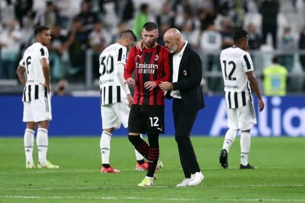 Ante Rebic of AC Milan and Stefano Pioli of AC Milan speaks with after the Serie A match between Juventus and AC Milan at Allianz Stadium on...