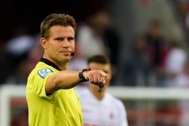 Referee Felix Brych gestures during the Bundesliga match between 1. FC Koeln and RB Leipzig at RheinEnergieStadion on September 18, 2021 in Cologne,...