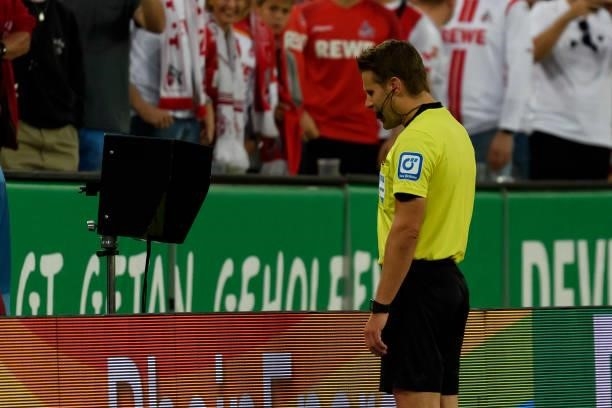 Referee Felix Brych looks on during the Bundesliga match between 1. FC Koeln and RB Leipzig at RheinEnergieStadion on September 18, 2021 in Cologne,...