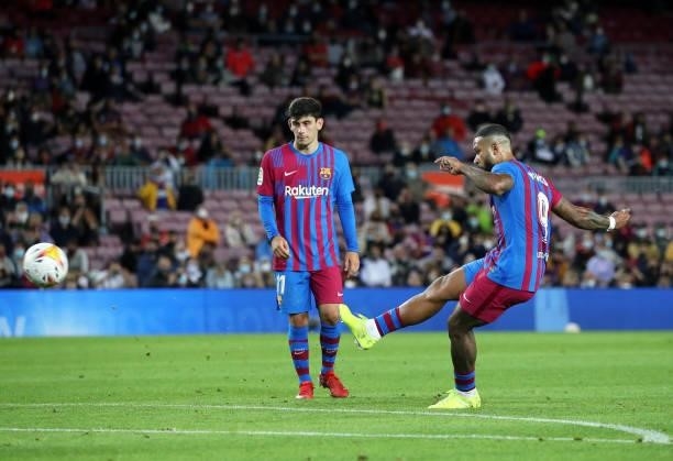 Memphis Depay and Yusuf Demir during the match between FC Barcelona and Granada CF, corresponding to the week 5 of the group A of the Liga Santander,...