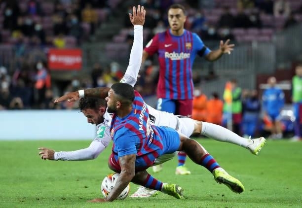 Memphis Depay and Quini during the match between FC Barcelona and Granada CF, corresponding to the week 5 of the group A of the Liga Santander,...