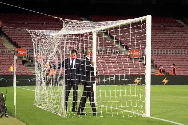 The referees checking the goal net before the match between FC Barcelona and Granada CF, corresponding to the week 5 of the group A of the Liga...