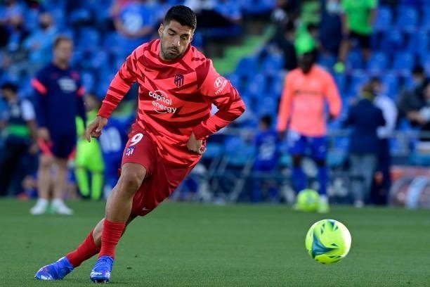 Atletico Madrid's Uruguayan forward Luis Suarez warms up prior the Spanish League football match between Getafe CF and Club Atletico de Madrid at the...