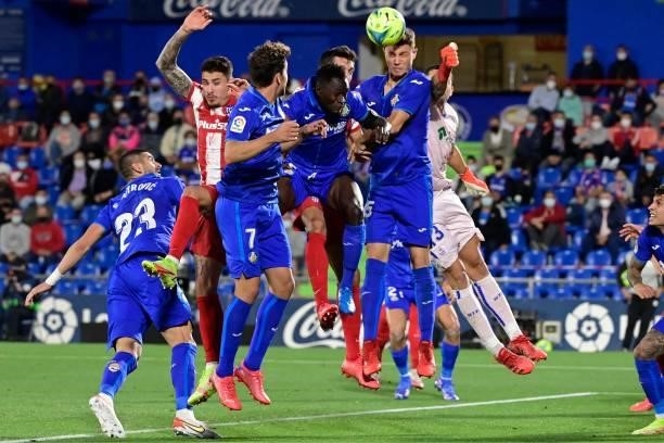 Getafe's Spanish defender Jorge Cuenca heads the ball during the Spanish League football match between Getafe CF and Club Atletico de Madrid at the...