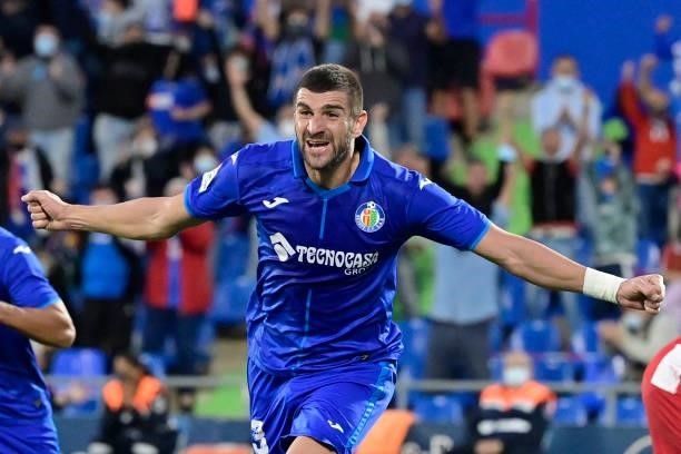 Getafe's Serbian defender Stefan Mitrovic celebrates his goal during the Spanish League football match between Getafe CF and Club Atletico de Madrid...