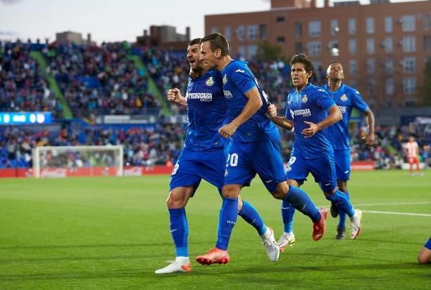 Mitrovic of Getafe CF celebrates after scoring his team's first goal with teammates during the LaLiga Santander match between Getafe CF and Club...