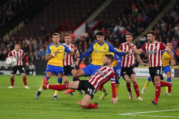 Oliver Norwood of Sheffield United clears the ball as Southampton look to get the winning goal during the Carabao Cup Third Round match between...