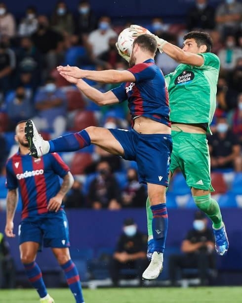 Matias Dituro of Celta Vigo and Shkodran Mustafi of UD Levante battle for the ball during the LaLiga Santander match between Levante UD and RC Celta...