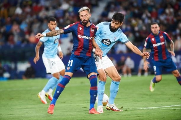 Jose Luis Morales of UD Levante and Nestor Araujo of Celta Vigo battle for the ball during the LaLiga Santander match between Levante UD and RC Celta...