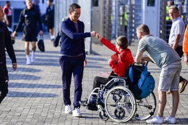 Coach Roger Schmidt gives a fan a boxing during the Dutch Eredivisie match between Go Ahead Eagles and PSV at De Adelaarshorst on September 22, 2021...
