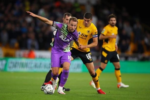 Harry Kane of Tottenham Hotspur and Conor Coady of Wolverhampton Wanderers stands dejected during the Carabao Cup Third Round match between...