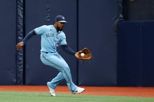 Teoscar Hernandez of the Toronto Blue Jays makes a running catch in the second inning during the game between the Toronto Blue Jays and the Tampa Bay...