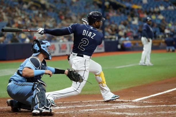 Yandy Diaz of the Tampa Bay Rays hits an RBI sacrifice fly in the third inning during the game between the Toronto Blue Jays and the Tampa Bay Rays...