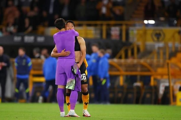 Son Heung-min of Tottenham Hotspur swaps shirts with fellow South Korea player Hwang Hee-chan of Wolverhampton Wanderers after the Carabao Cup Third...