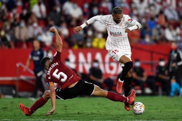 Youssef En-Nesyri of Sevilla and Gabriel Paulista of Valencia compete for the ball during the La Liga Santander match between Sevilla FC and Valencia...